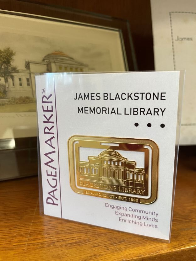 engraved metal bookmark showing image of library building