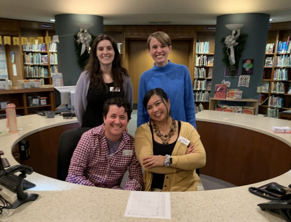 Picture features four staff members of the Youth Services department